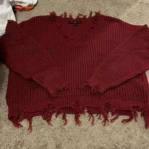 Red distressed sweater